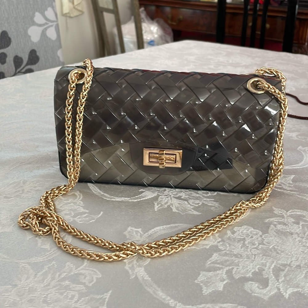 Crossi women’s dark gray jelly purse. Preowned excellent condition.Gold hardware
